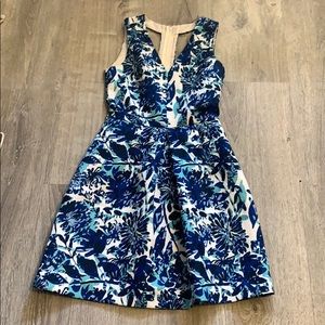 Blue floral structured coattail dress.
